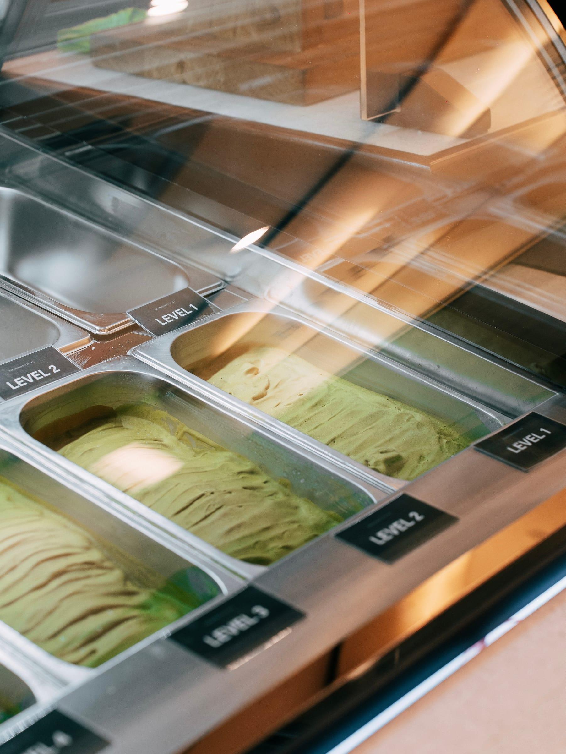 Trays of matcha ice cream in the counter, labelled Level 1, 2 and 3